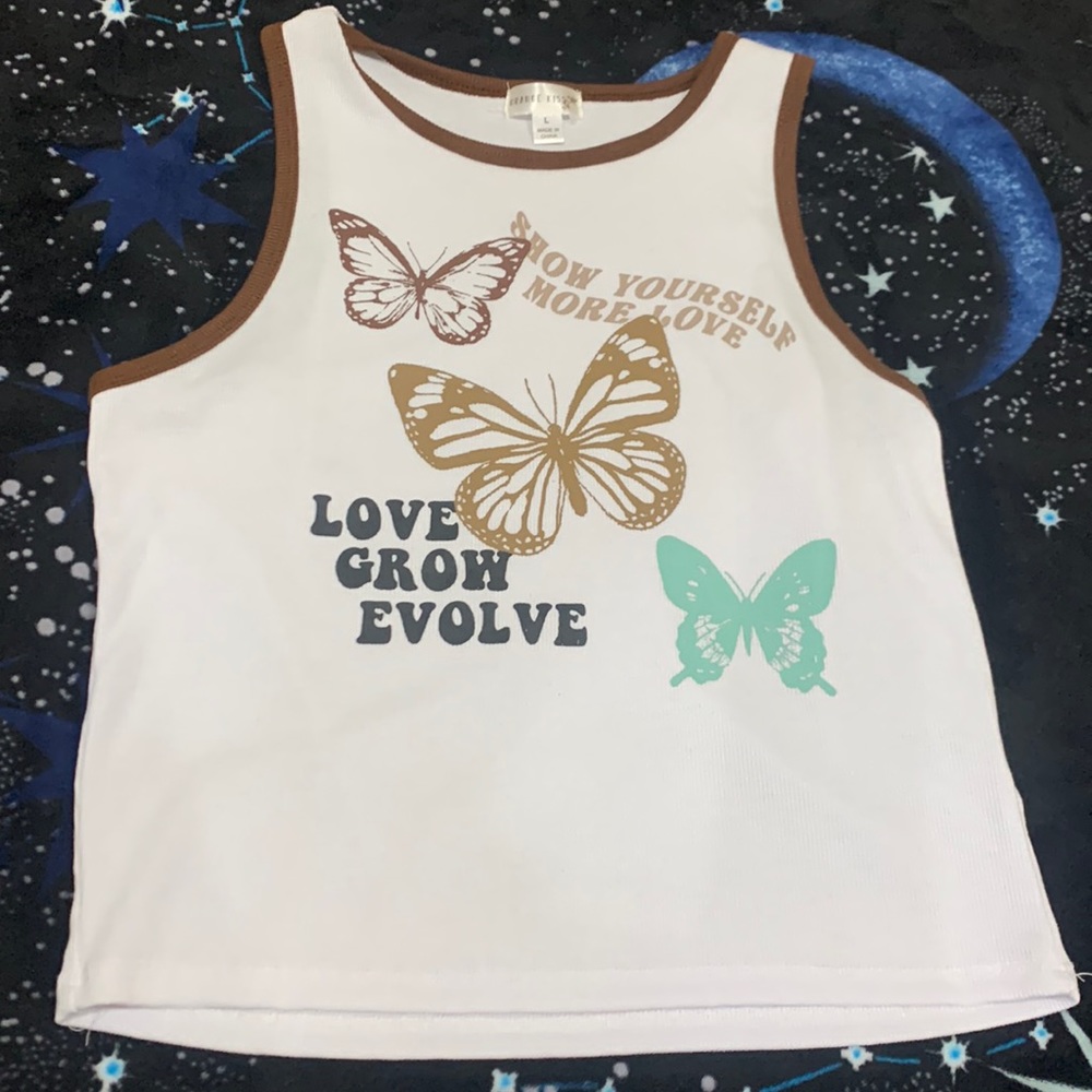 White shirt whit brown butterflies and a brown outline with positive phrases